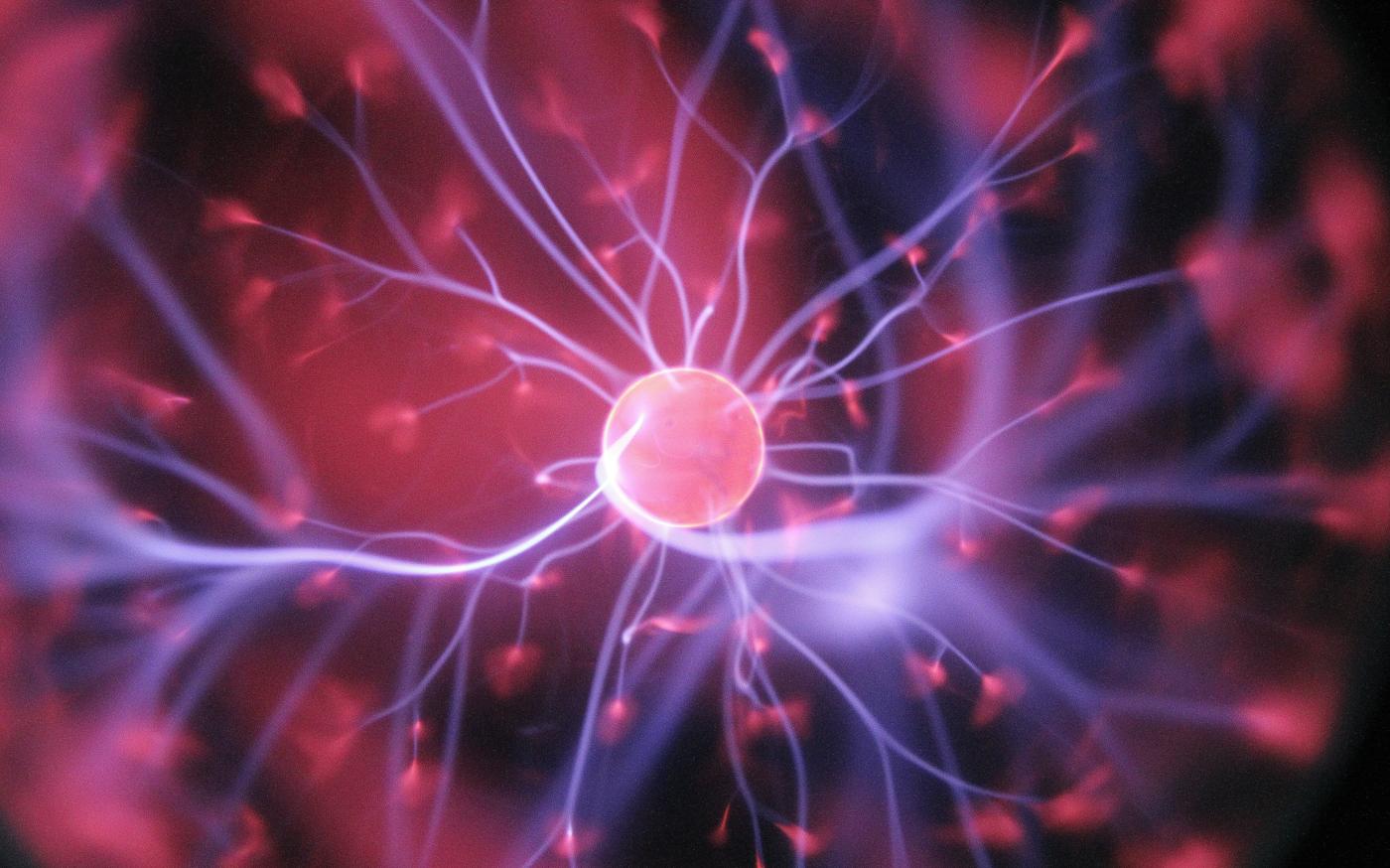 purple and pink plasma ball by Hal Gatewood courtesy of Unsplash.